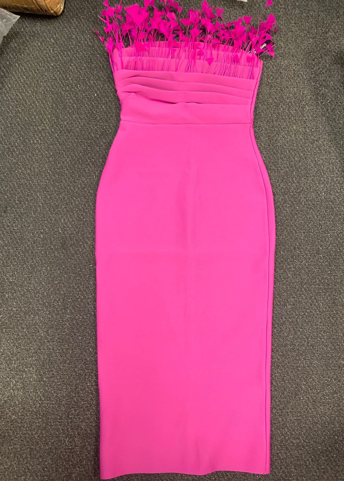 Feather-trim neckline detail on women's hot pink bandage midi dress