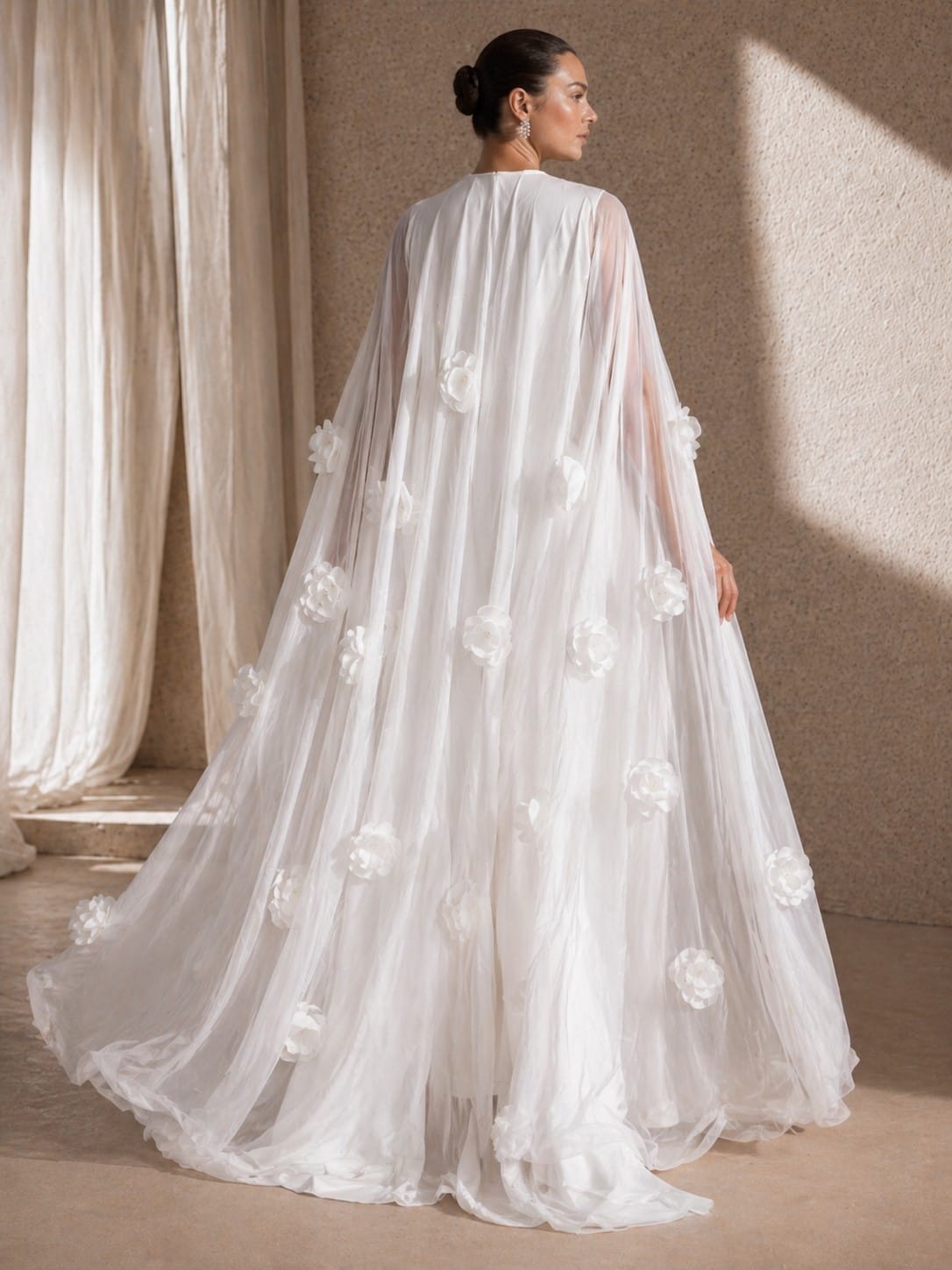 Women's white long sleeve maxi dress with 3D floral cape - train