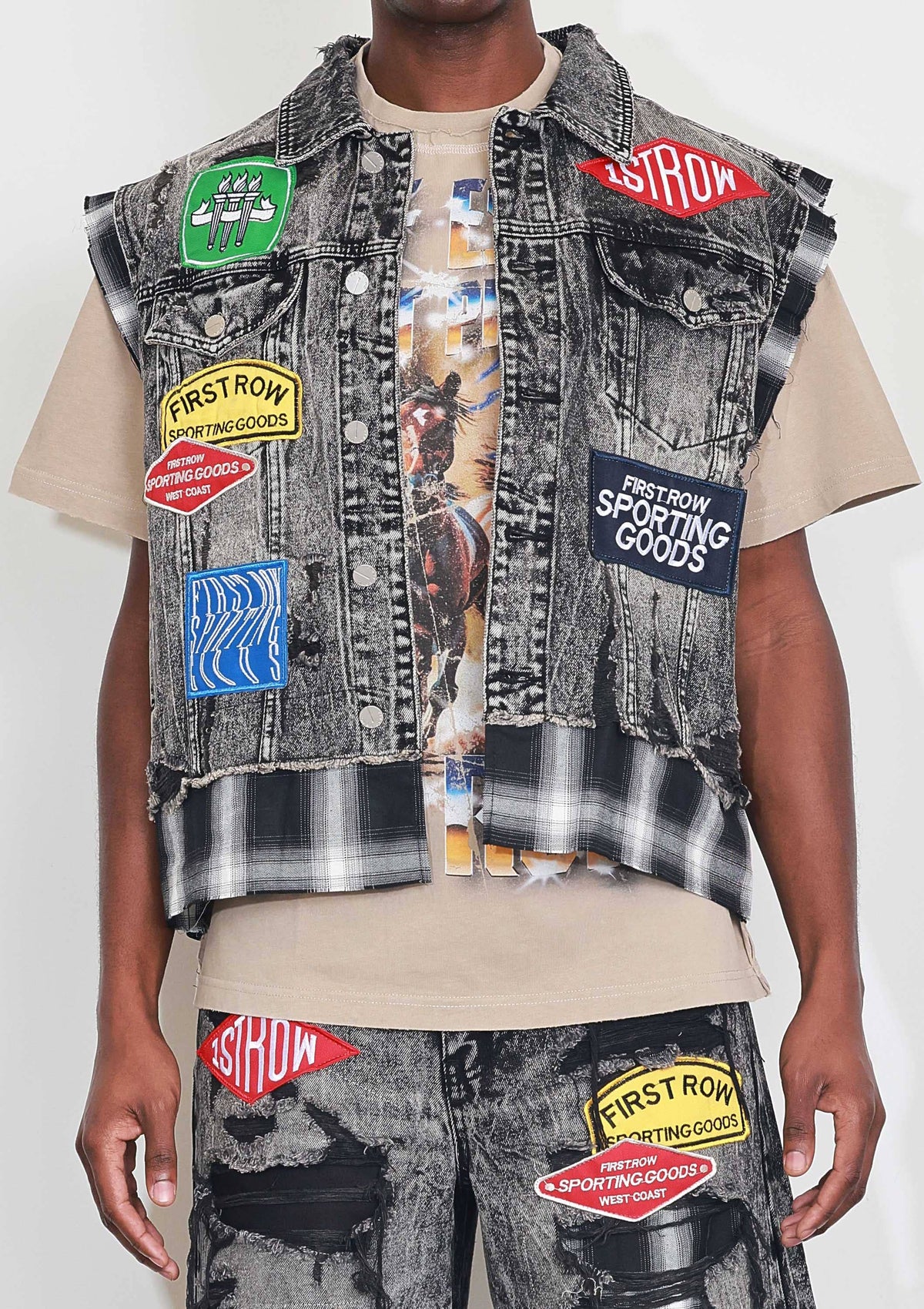 Men's black stone wash distressed cut-off denim vest with plaid and multi patches