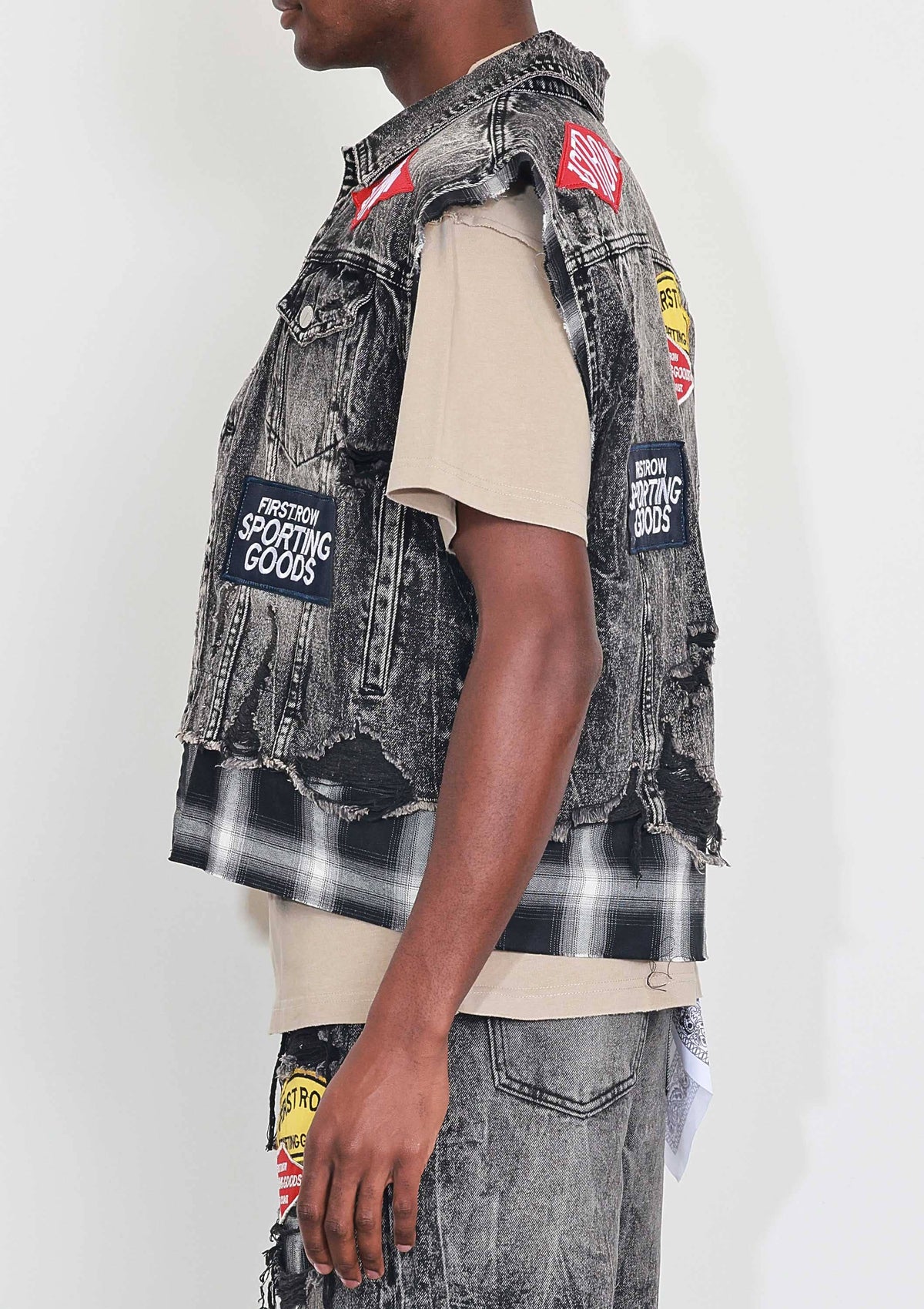 Men's black stone wash distressed cut-off denim vest with plaid and multi patches