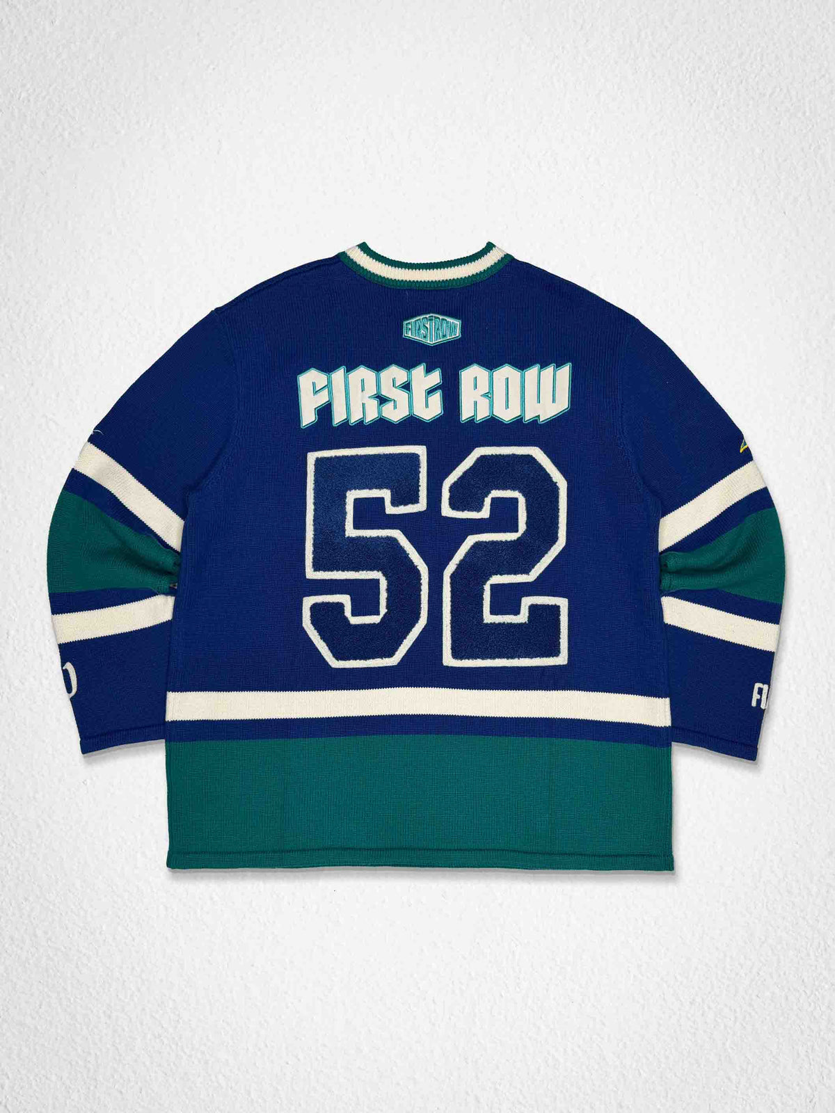 Men's blue stadium sweater with embroidered script and patch details
