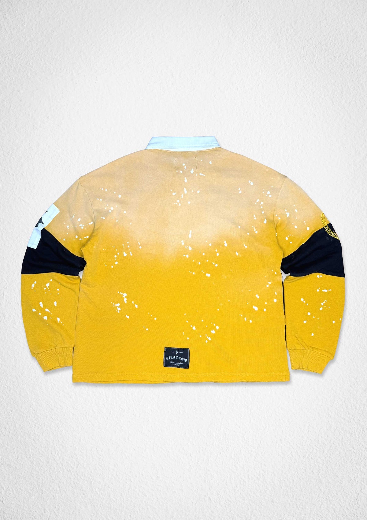 Men's yellow French terry long sleeve polo with crest patches and appliqué