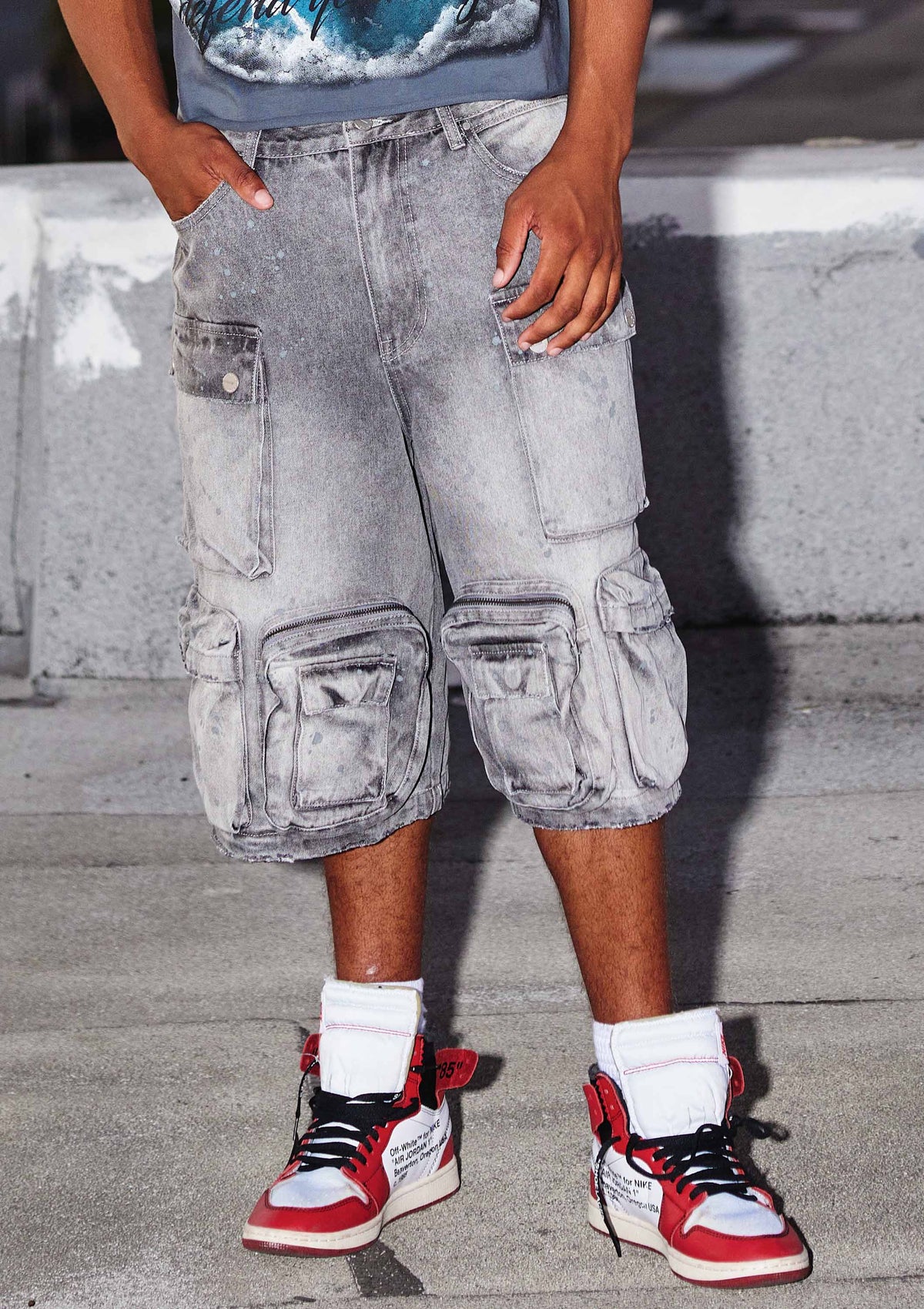 Men's grey stone denim cargo jorts with ink splatter detail