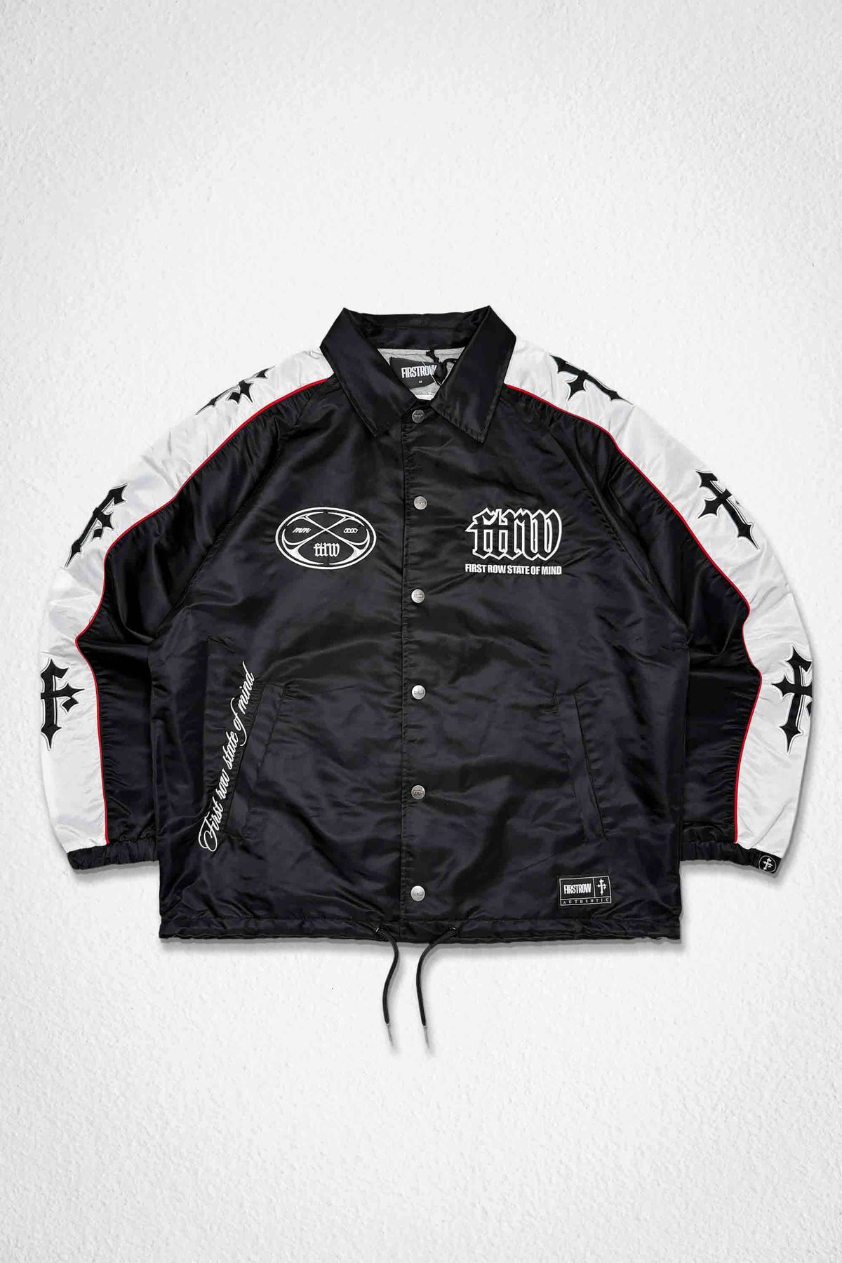 Men's black nylon coach jacket with racer-style panels and patch details