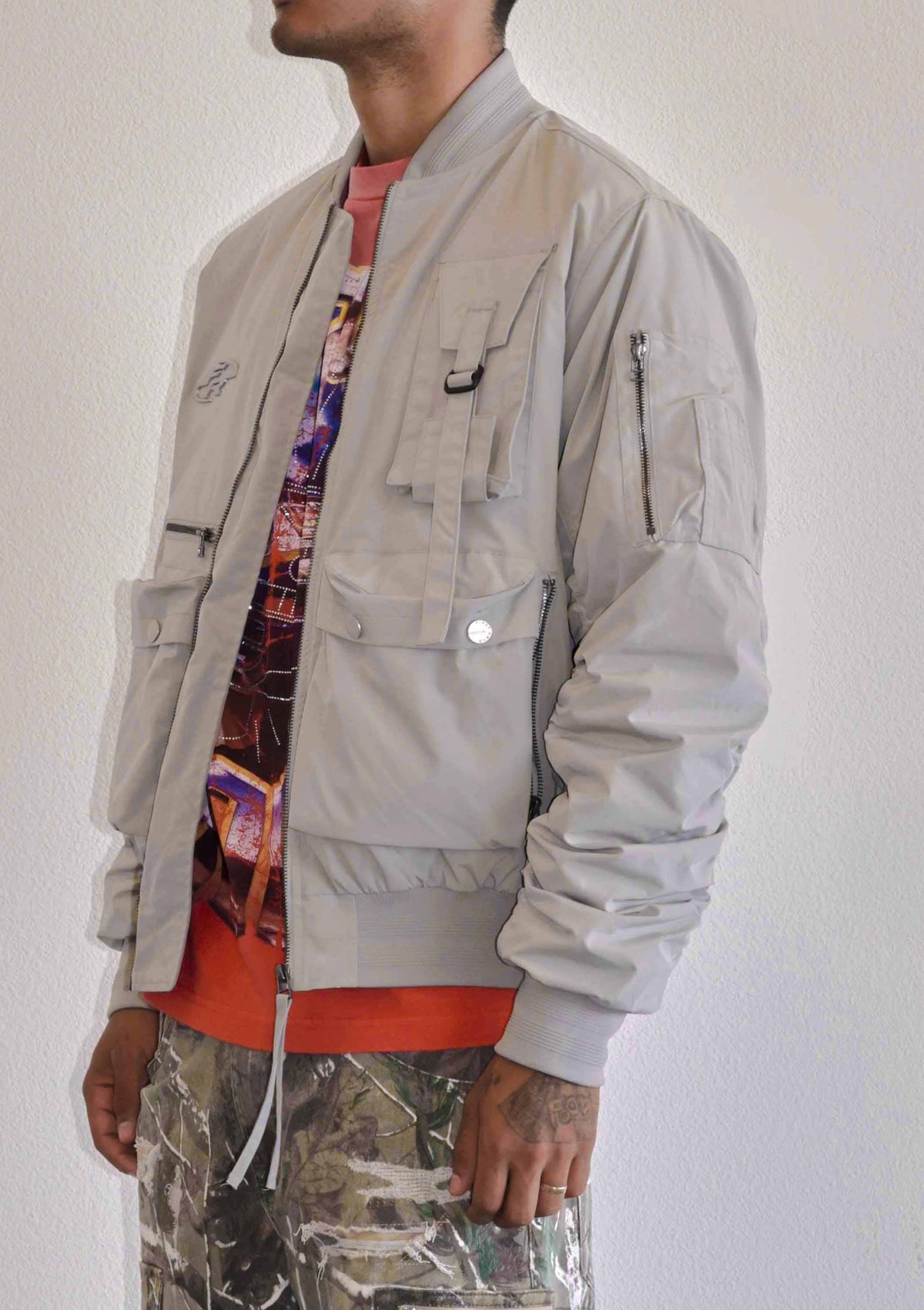 Men's light grey oversized utility MA-1 bomber jacket with quilted lining and zip front