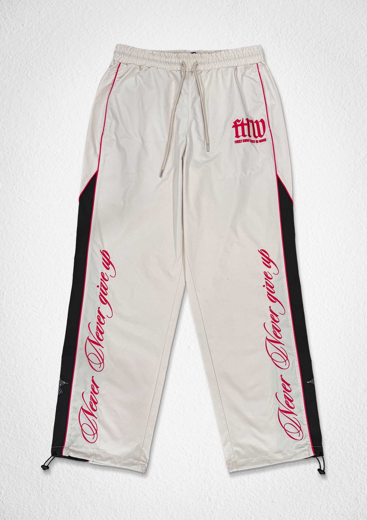 Men's ecru paneled track pants with patch detail