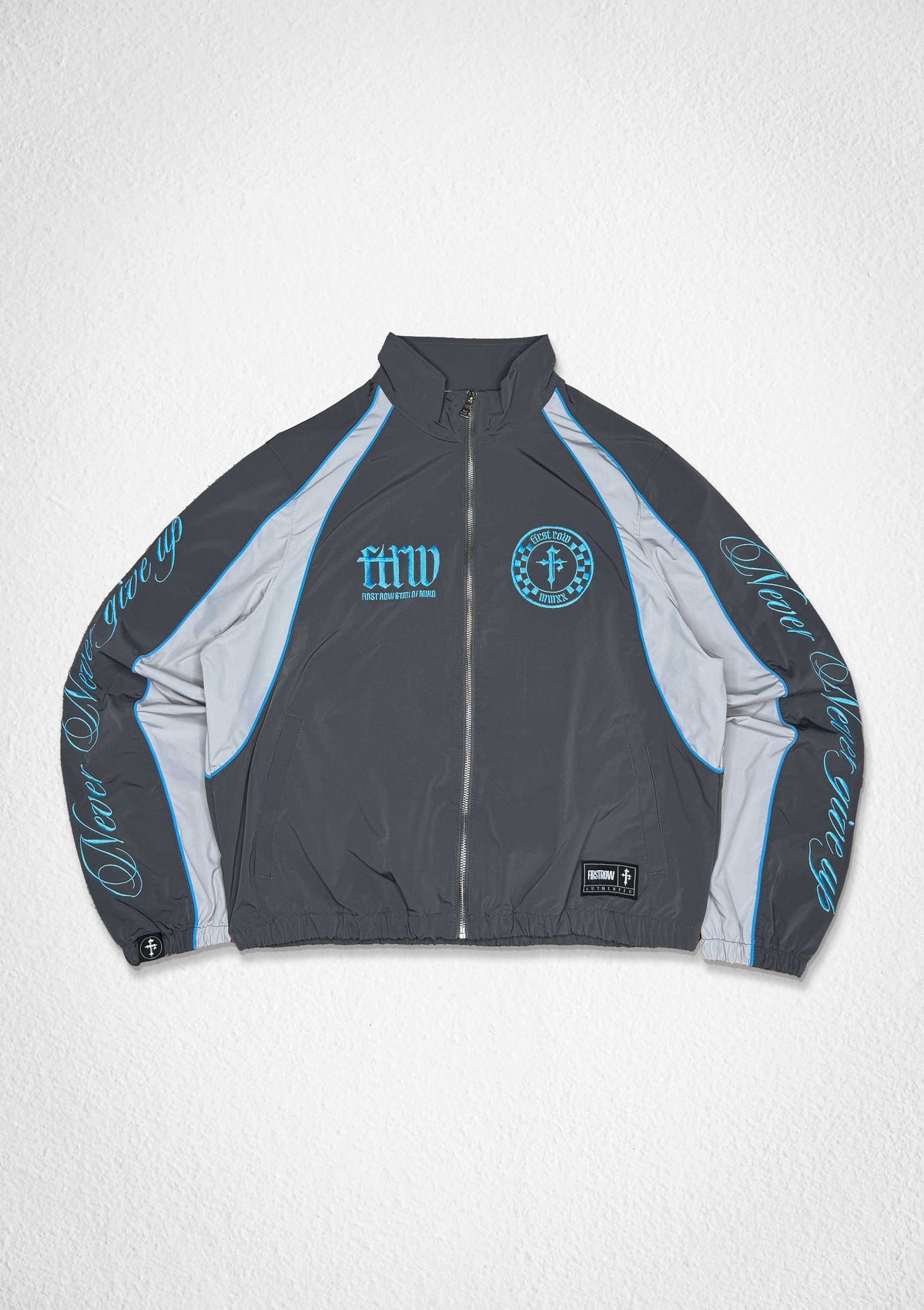 Men's gray zip track jacket with paneled body and patch details