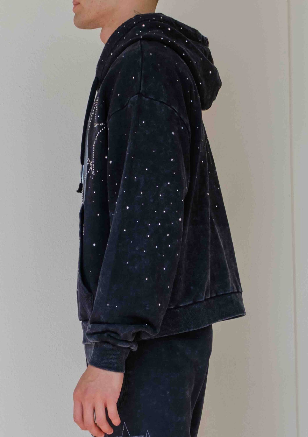 Men's black washed cotton pullover hoodie with rhinestone studded angel graphic and kangaroo pocket