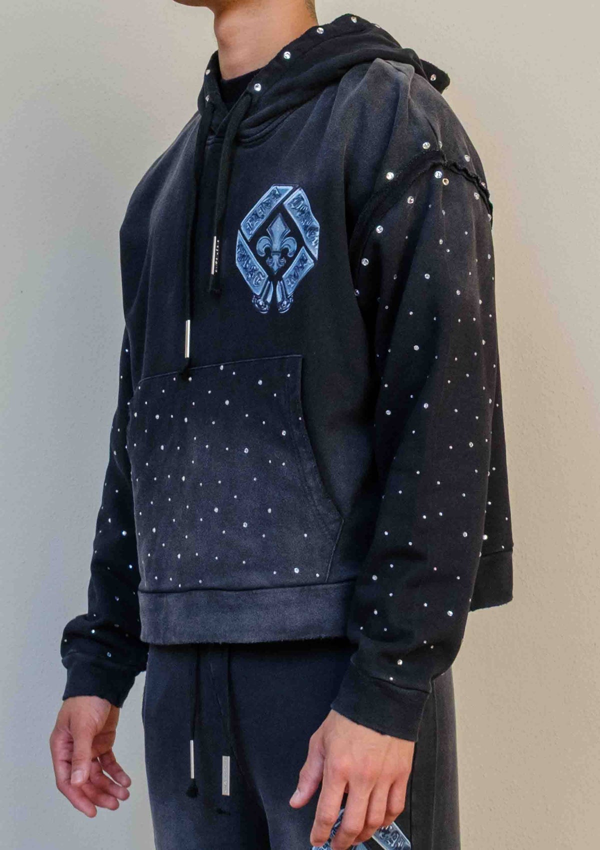 Men's black washed cotton cropped pullover hoodie with rhinestone graphic and kangaroo pocket