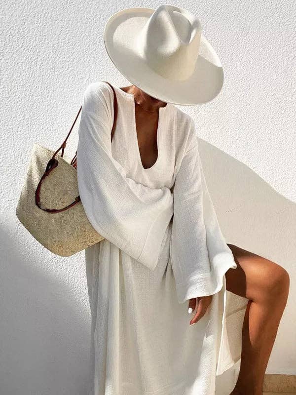 Women's deep V-neck flared sleeve midi dress in white or black – front view