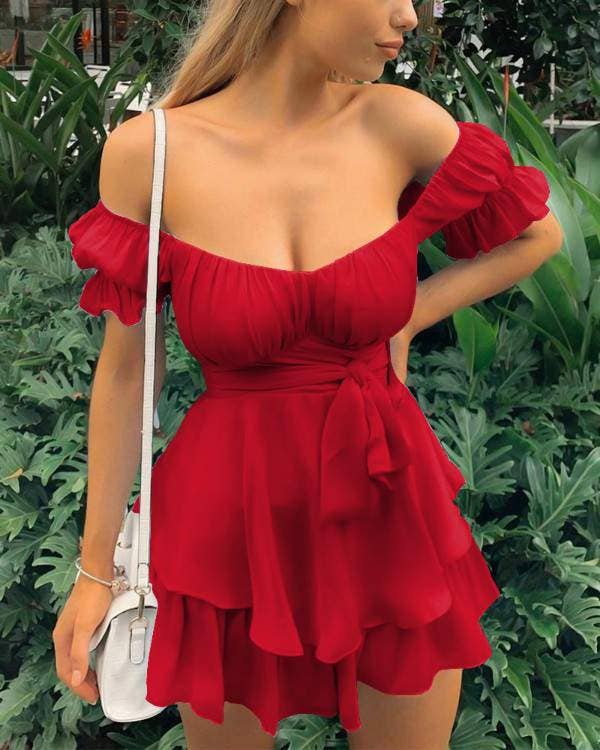 Women's red cold shoulder ruffle hem mini dress on model