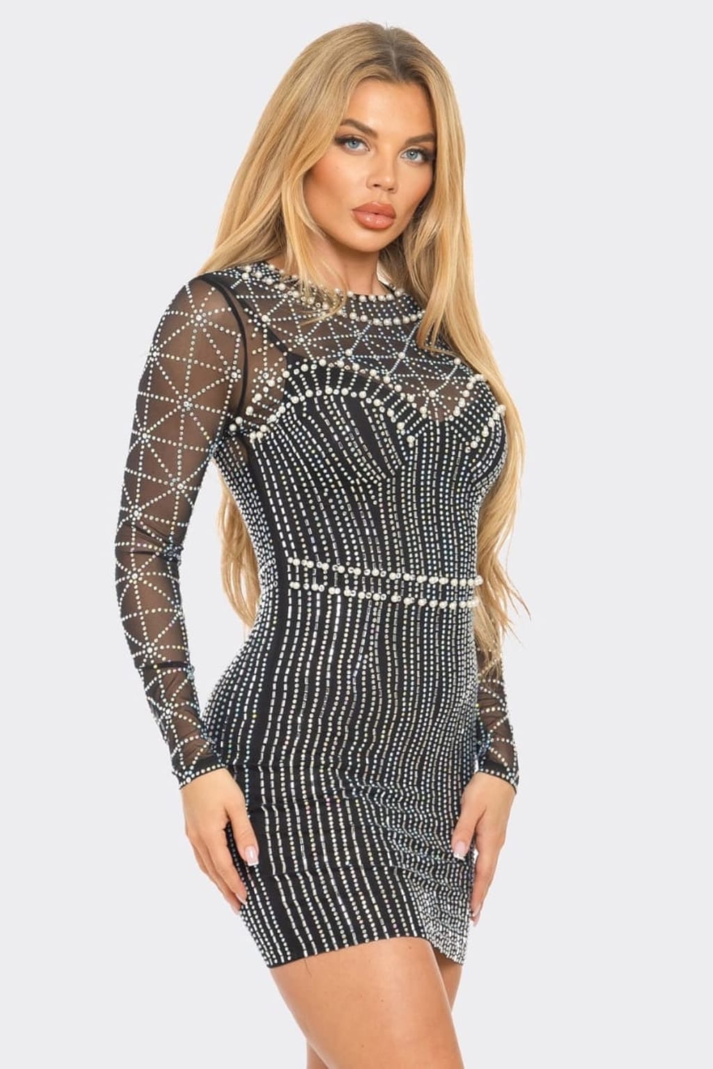 Black rhinestone pearl mesh long sleeve mini dress styled for a holiday party