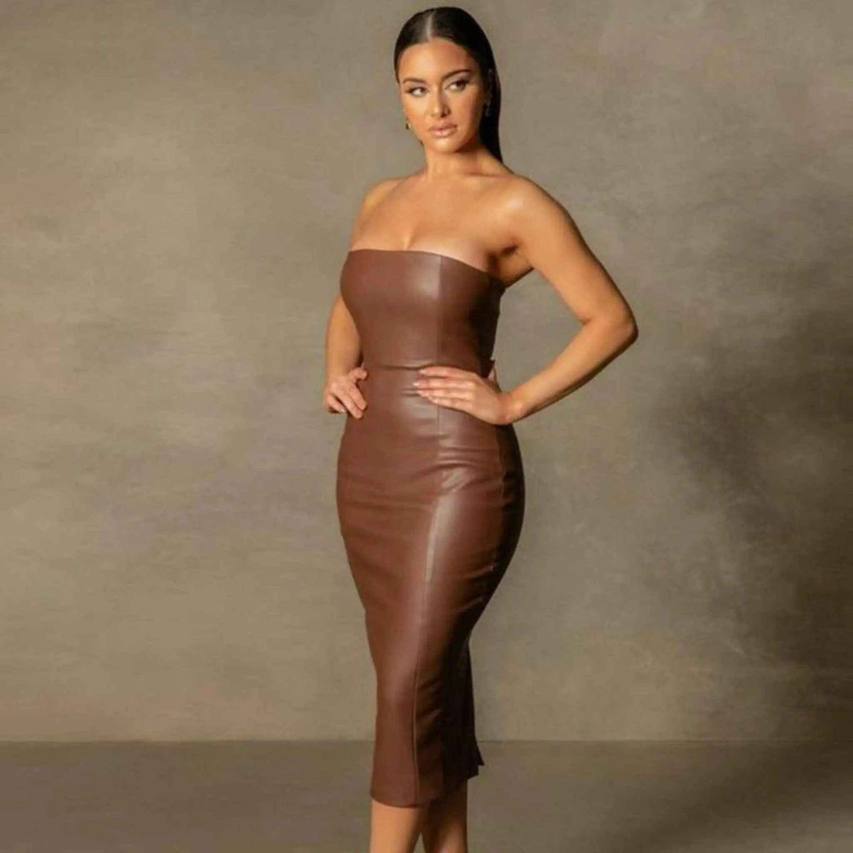 Leatherette dresses: black faux leather midi dress styled for a fall night out