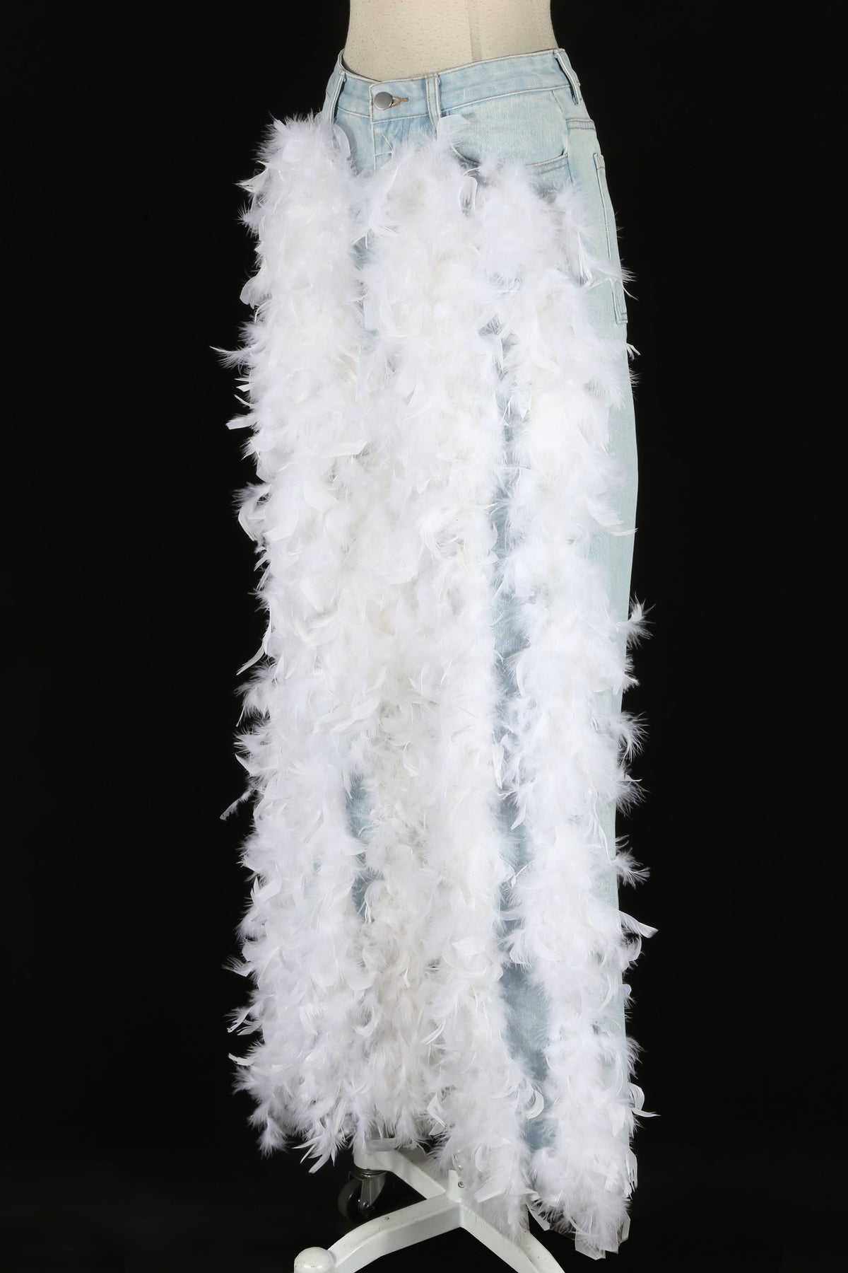Feather trim detail on women's light wash wide-leg jeans