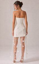 Women's white strapless corset dress with embellished overlay - back