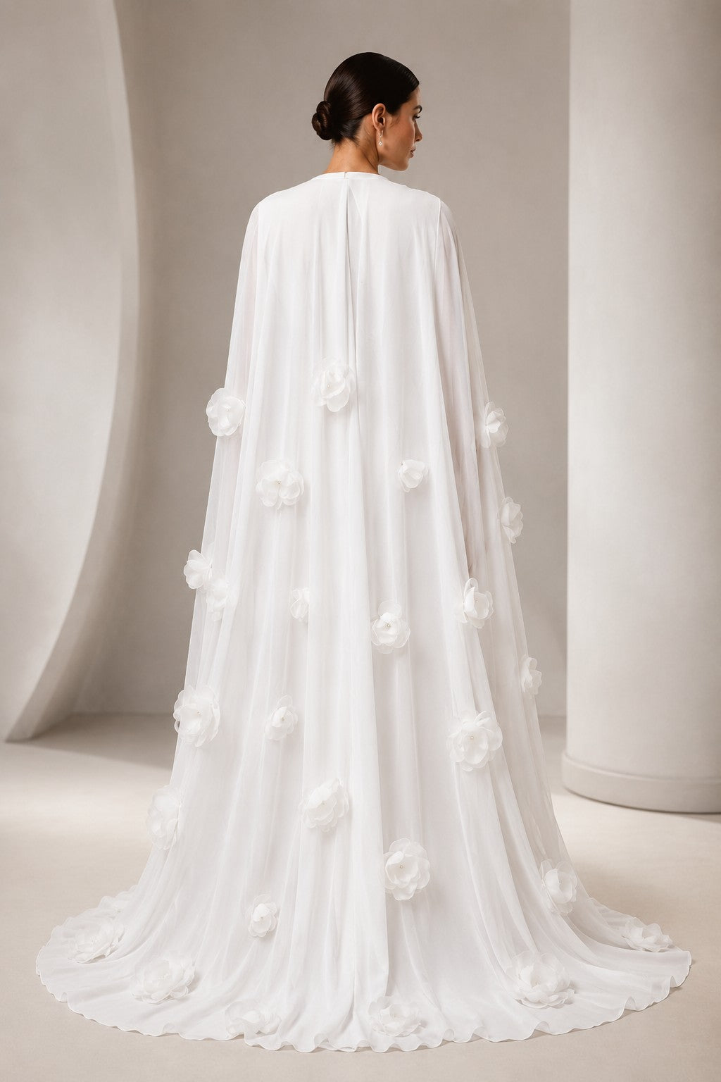 Women's white long sleeve maxi dress with 3D floral cape - back