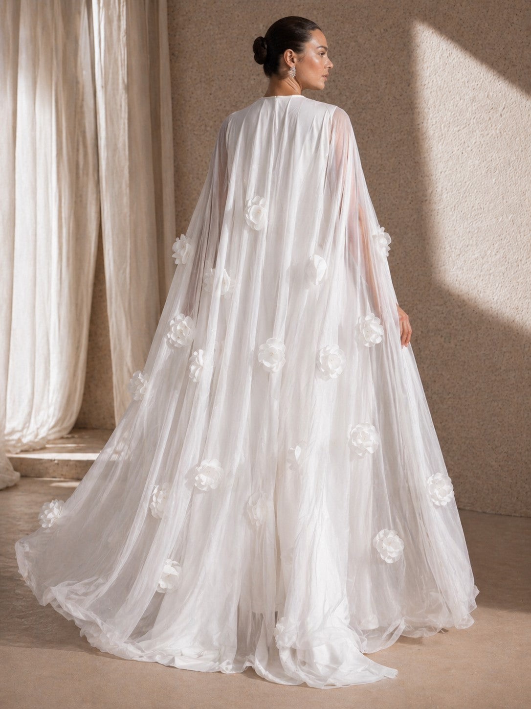 Women's white long sleeve maxi dress with 3D floral cape - train
