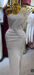 Rhinestone pleated detail on women's white one-shoulder maxi dress
