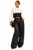 Women's ivory ribbed knit sweater with black lace hem