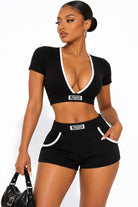 Women's black deep-V bralette and mini shorts set