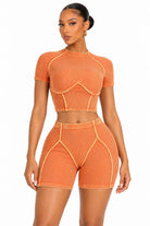Women's orange mock neck crop top and shorts set