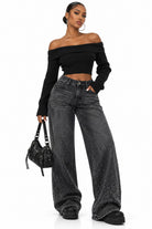 Women's low rise baggy rhinestone jeans black denim on model