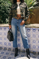 Women's camo pearl rhinestone cropped denim jacket on model