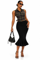 Women's ribbed knit midi skirt with ruffle hem on model