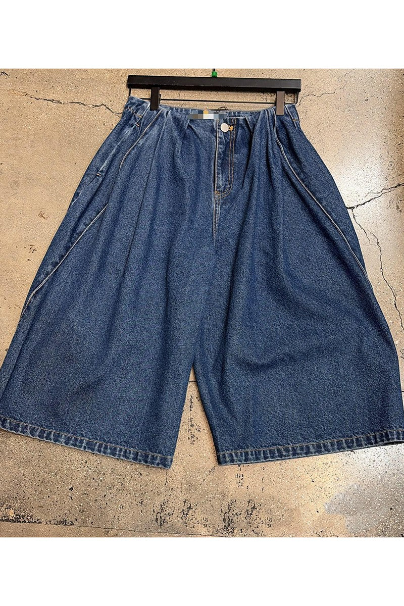 Pleated denim jorts flat lay