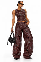 Women's burgundy faux leather grommet vest and wide leg pants set