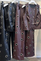 Faux leather vest and pants set flat lay