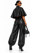 Faux leather capelet top and balloon pants side view