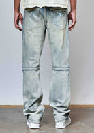 Men's medium stone flare jeans with allover rhinestones and rip and repair
