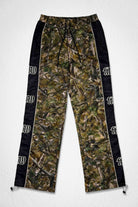 Men's camo nylon paneled track pants with patch detail