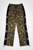 Men's camo nylon paneled track pants with patch detail