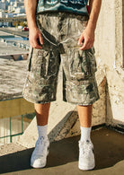 Men's washed denim cargo jorts with camo print