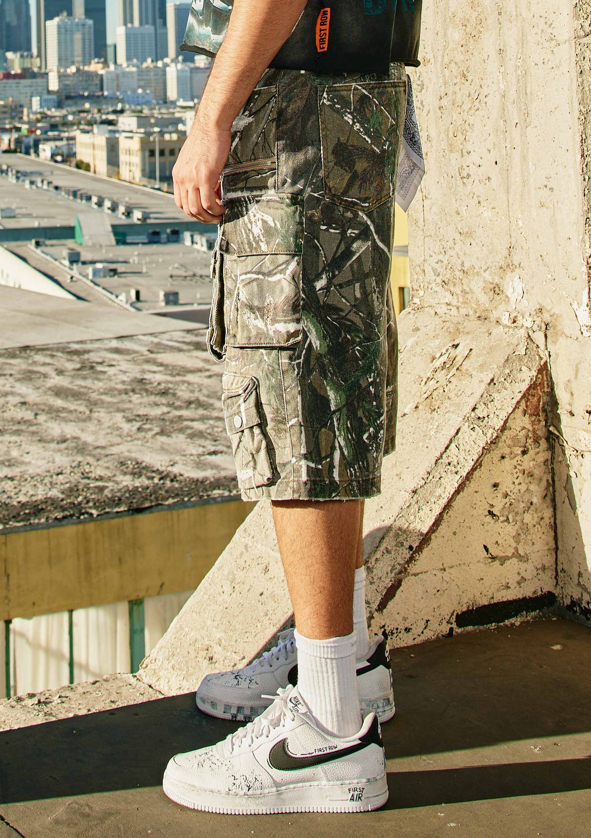 Men's washed denim cargo jorts with camo print