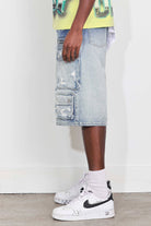 Men's medium blue distressed denim cargo jorts with raw hem