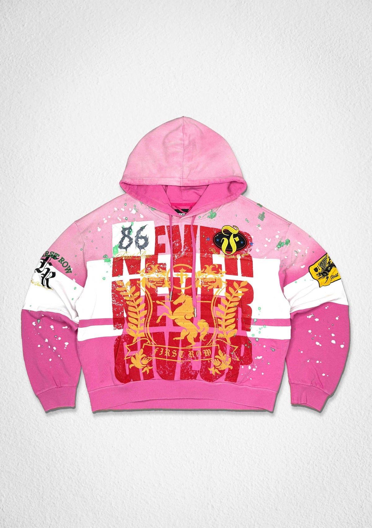 Men's pink French terry pullover hoodie with embroidered 86 graphic and patch details