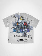 Men's light grey washed tee with hand-painted clown graphic and studs