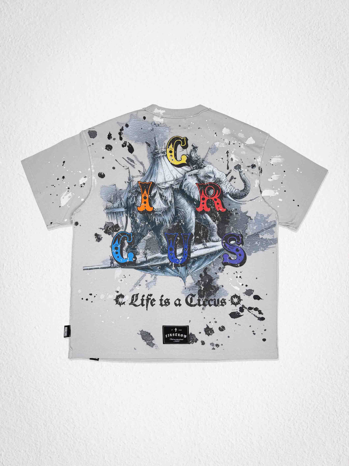 Men's light grey washed tee with hand-painted clown graphic and studs