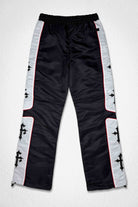 Men's black nylon paneled track pants with patch detail