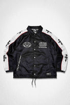 Men's black nylon coach jacket with racer-style panels and patch details