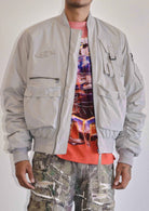 Men's light grey oversized utility MA-1 bomber jacket with quilted lining and zip front