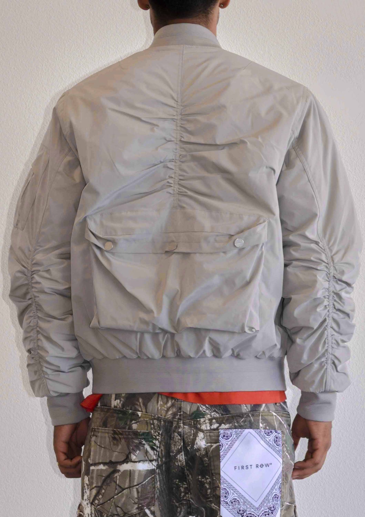 Men's light grey oversized utility MA-1 bomber jacket with quilted lining and zip front