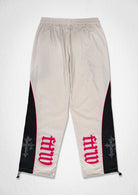 Men's ecru paneled track pants with patch detail