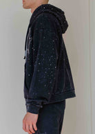 Men's black washed cotton pullover hoodie with rhinestone studded angel graphic and kangaroo pocket