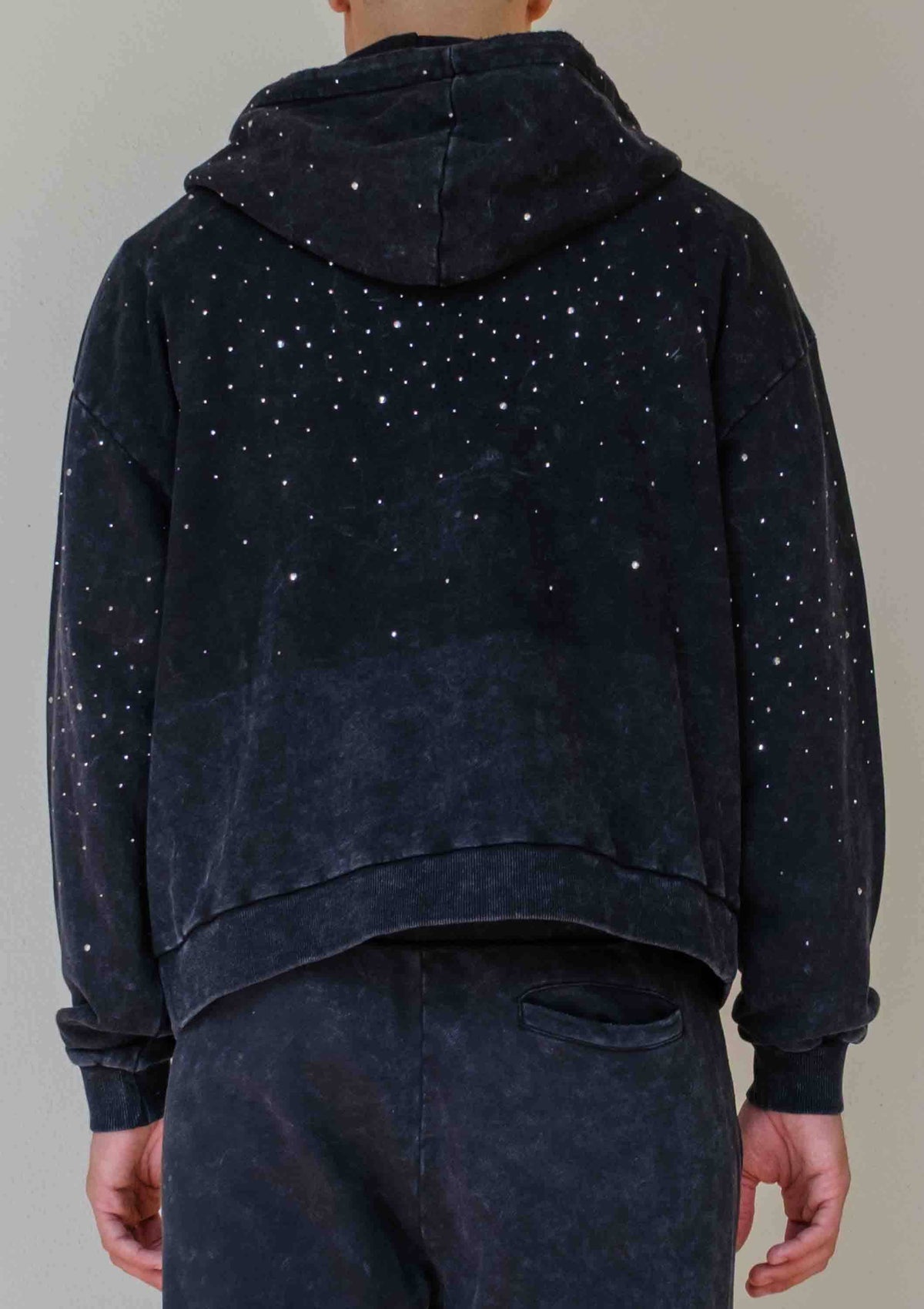 Men's black washed cotton pullover hoodie with rhinestone studded angel graphic and kangaroo pocket