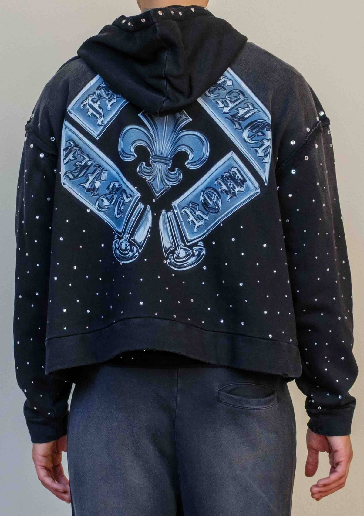 Men's black washed cotton cropped pullover hoodie with rhinestone graphic and kangaroo pocket