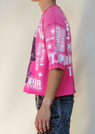 Men's pink cropped terry tee with studded rubber graphic
